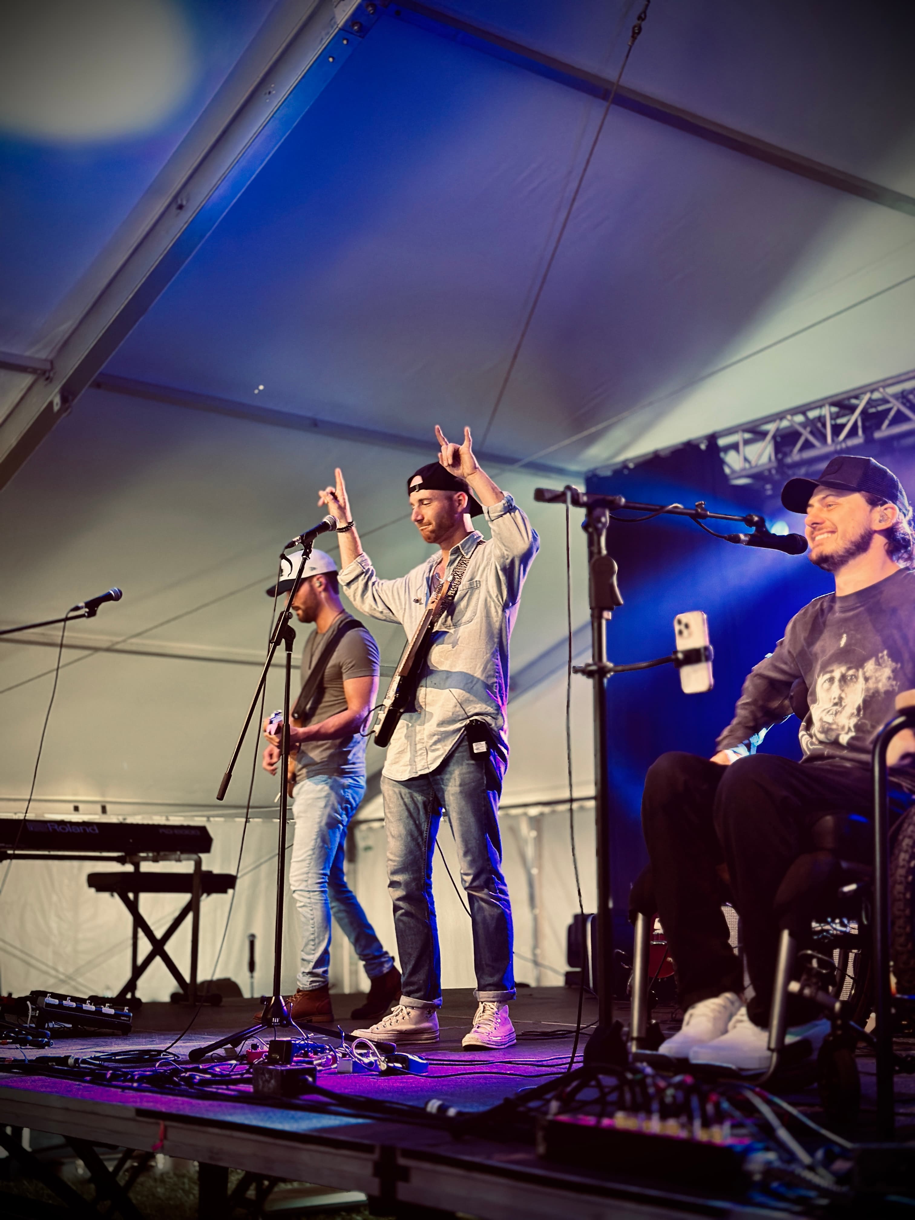 HIRTLE performing live under blue stage lights